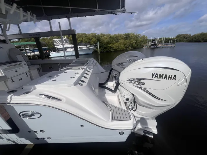  Yacht Photos Pics 2021 Sea Fox 368 Commander with Yamaha outboard engines docked by the water.