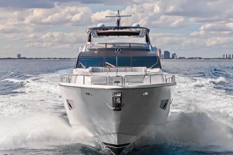 Aqua Vista Yacht Photos Pics 2019 Sunseeker 86 Yacht cruising on open water under a cloudy sky.