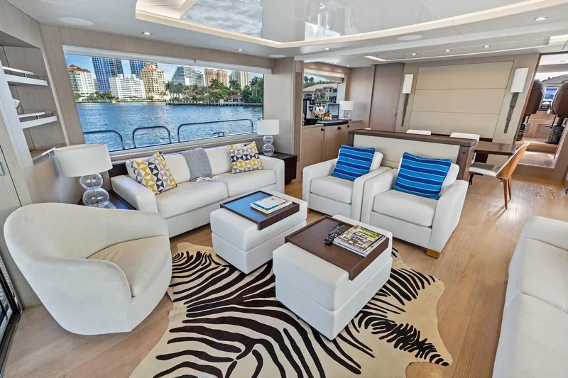 Aqua Vista Yacht Photos Pics Luxurious interior of 2019 Sunseeker 86 Yacht with modern furnishings and waterfront view.
