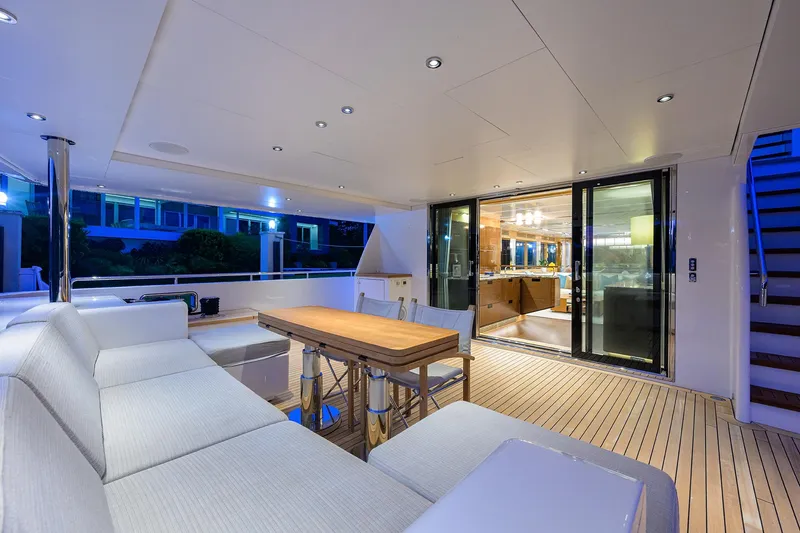 Uptight Yacht Photos Pics Luxurious interior of 2022 Cantiere Delle Marche Darwin 106 yacht with modern seating and lighting.