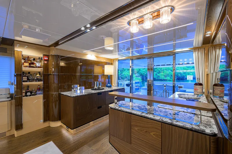 Uptight Yacht Photos Pics Luxurious interior of 2022 Cantiere Delle Marche Darwin 106 yacht with elegant wood and marble finishes.