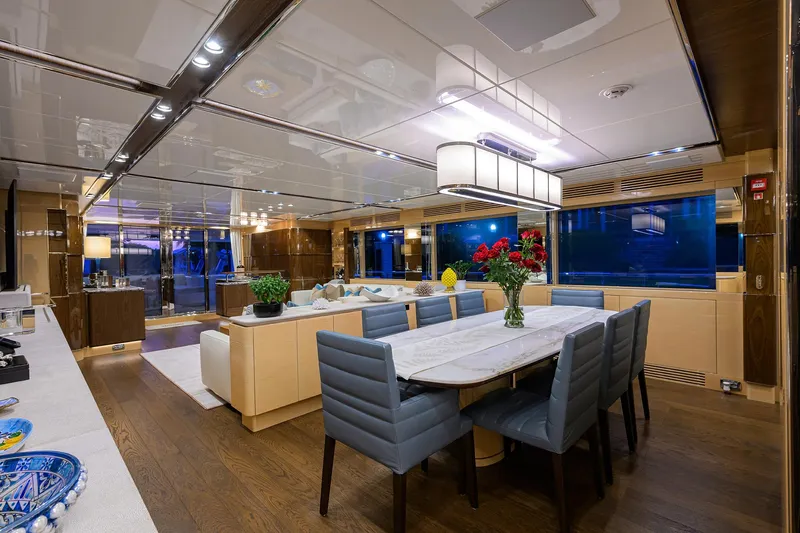 Uptight Yacht Photos Pics Luxurious interior of 2022 Cantiere Delle Marche Darwin 106 yacht, featuring elegant dining area.