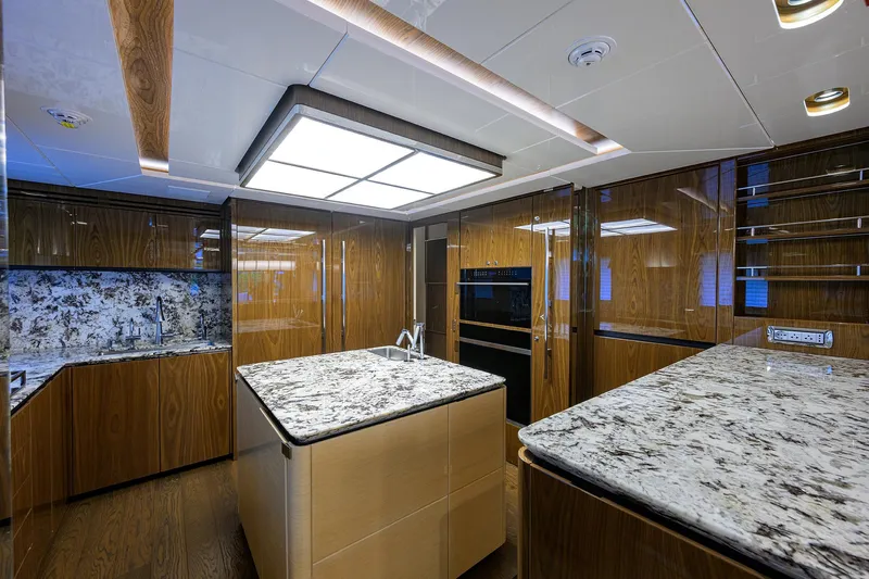Uptight Yacht Photos Pics Luxurious kitchen interior of 2022 Cantiere Delle Marche Darwin 106 yacht.