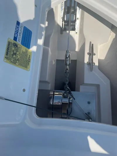  Yacht Photos Pics 2018 Pursuit DC 295 Dual Console anchor compartment with chain and cleat.