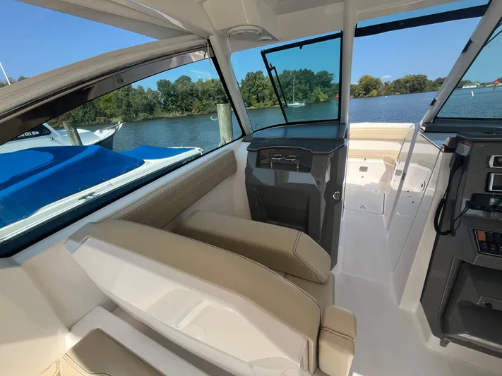  Yacht Photos Pics 2018 Pursuit DC 295 Dual Console boat interior with lake view.