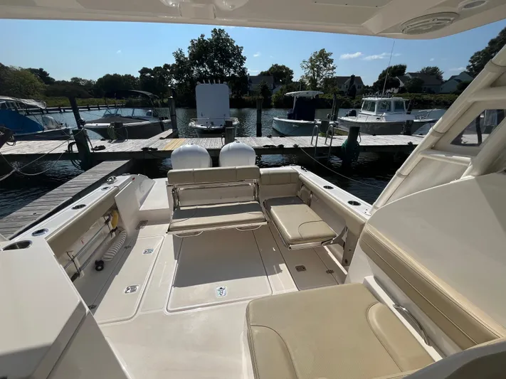 Yacht Photos Pics 2018 Pursuit DC 295 Dual Console boat interior at marina dock.