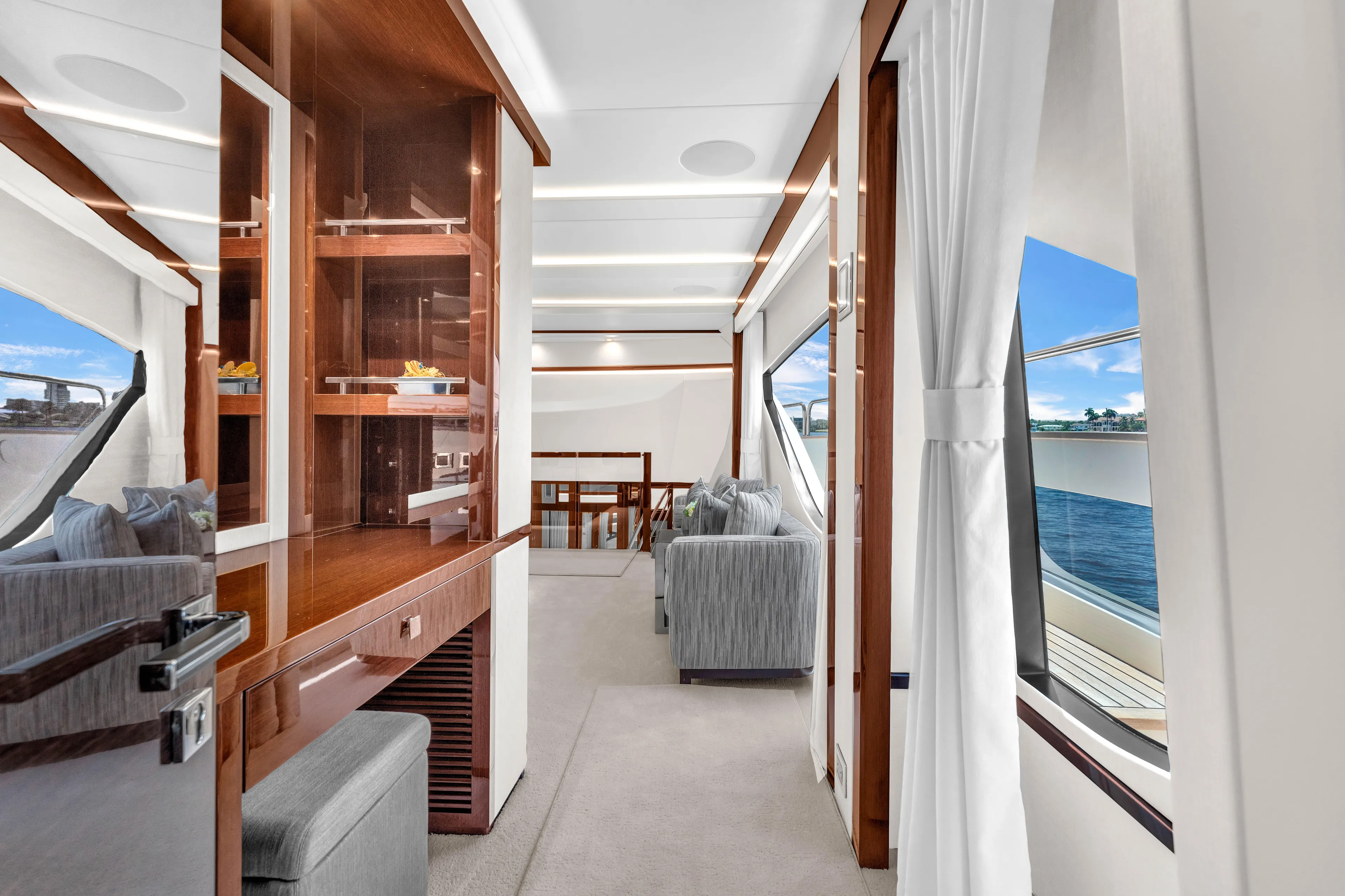 Karillian & Company Yacht Photos Pics Luxurious interior of 2018 Sunseeker 95 Yacht with elegant furnishings and ocean view.