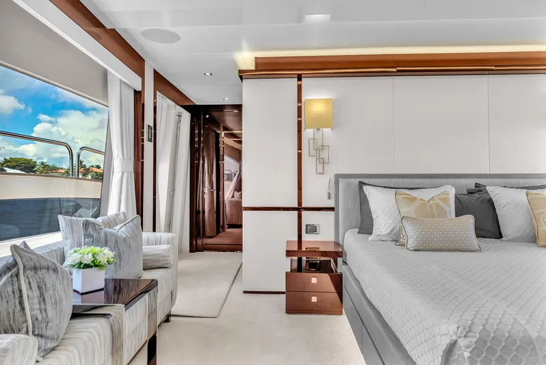 Karillian & Company Yacht Photos Pics Luxurious interior of 2018 Sunseeker 95 Yacht with elegant bedroom and seating area.