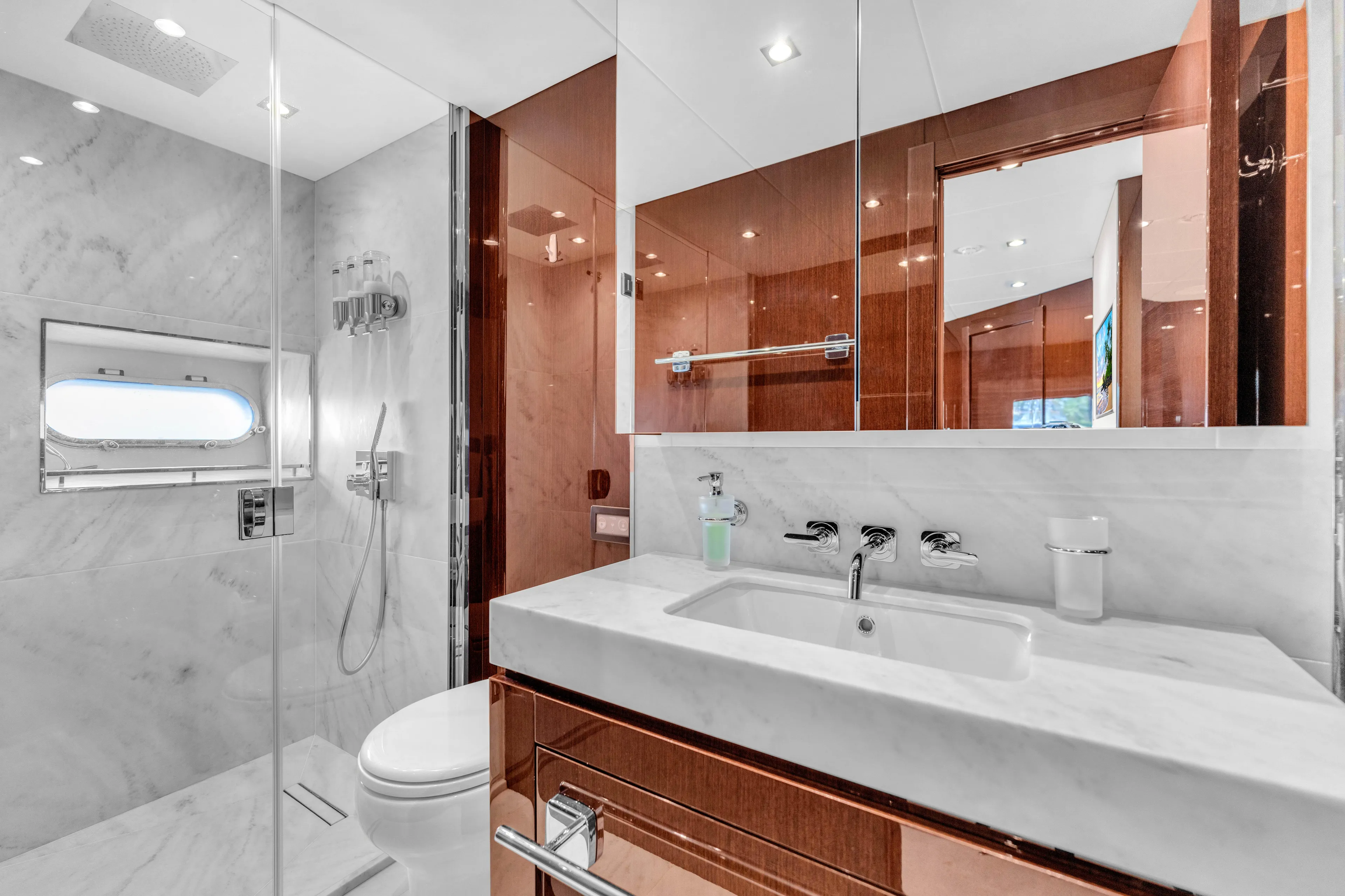 Karillian & Company Yacht Photos Pics Luxurious bathroom on 2018 Sunseeker 95 Yacht with marble and wood finishes.