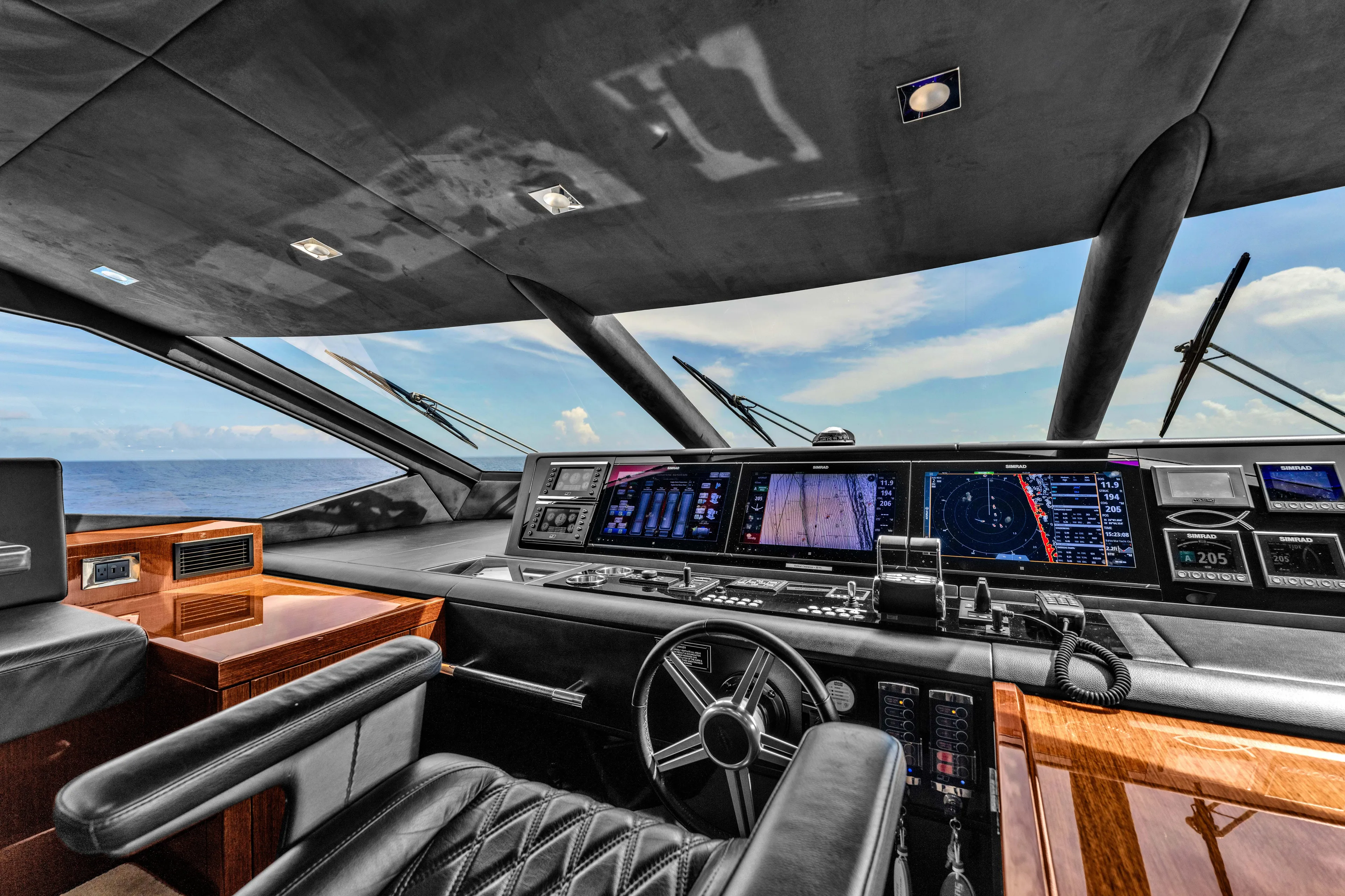 Karillian & Company Yacht Photos Pics Luxurious Sunseeker 95 Yacht 2018 helm with advanced navigation systems and ocean view.