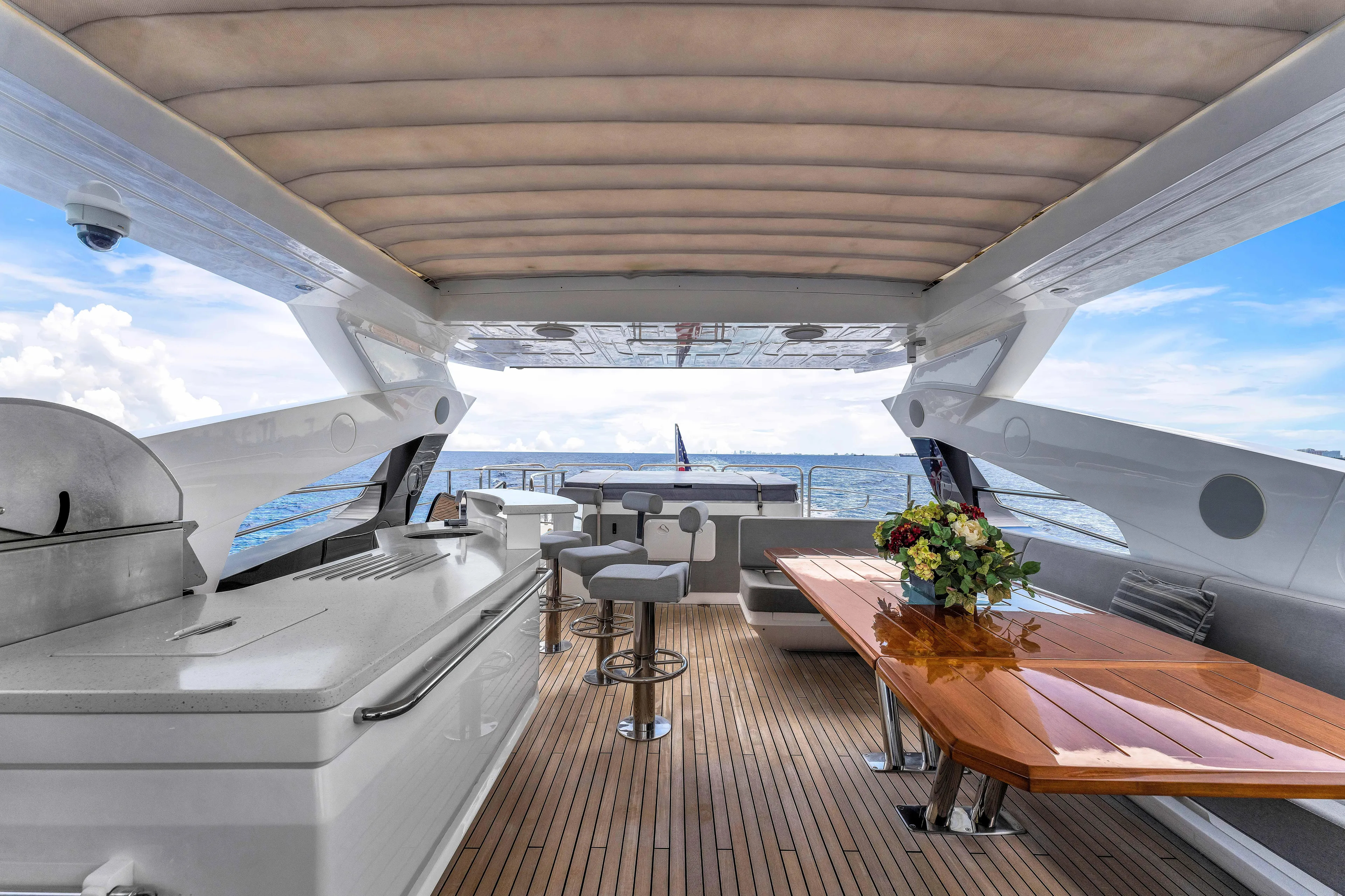 Karillian & Company Yacht Photos Pics Luxurious 2018 Sunseeker 95 Yacht deck with elegant seating and ocean view.