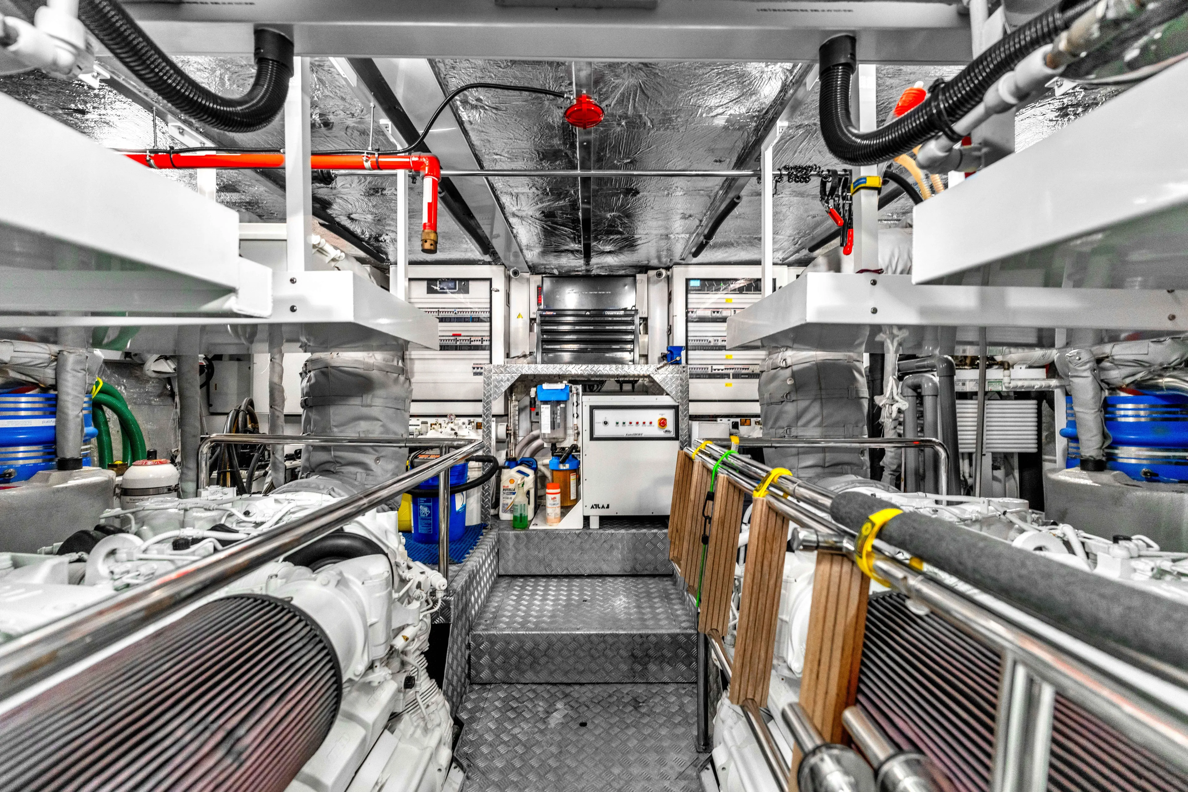 Karillian & Company Yacht Photos Pics Engine room of 2018 Sunseeker 95 Yacht, showcasing advanced machinery and equipment.