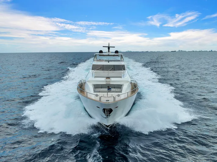 Karillian & Company Yacht Photos Pics 2018 Sunseeker 95 Yacht cruising on open water under a clear blue sky.