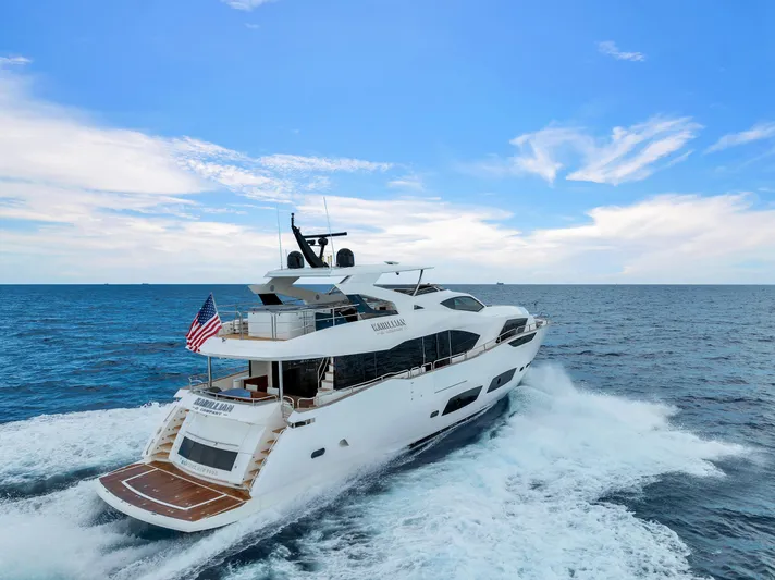 Karillian & Company Yacht Photos Pics 2018 Sunseeker 95 Yacht cruising on open sea under blue sky.