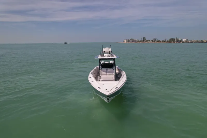 My Mermaid Yacht Photos Pics 2020 Nor-Tech 390 Sport Center Console boat cruising on calm ocean waters.