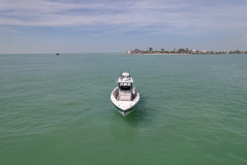 My Mermaid Yacht Photos Pics 2020 Nor-Tech 390 Sport Center Console on open water, distant shoreline visible.