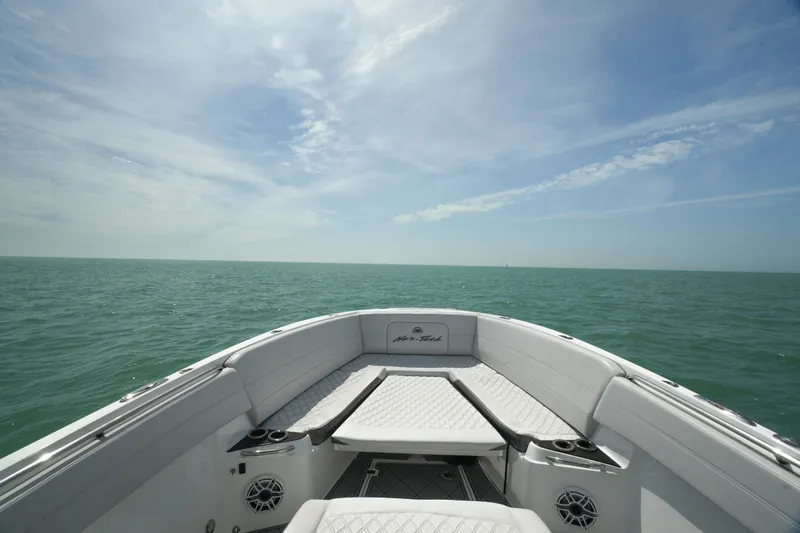 My Mermaid Yacht Photos Pics 2020 Nor-Tech 390 Sport Center Console boat on open sea under clear sky.