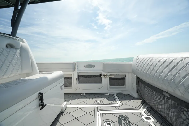 My Mermaid Yacht Photos Pics 2020 Nor-Tech 390 Sport Center Console interior with cushioned seating and ocean view.