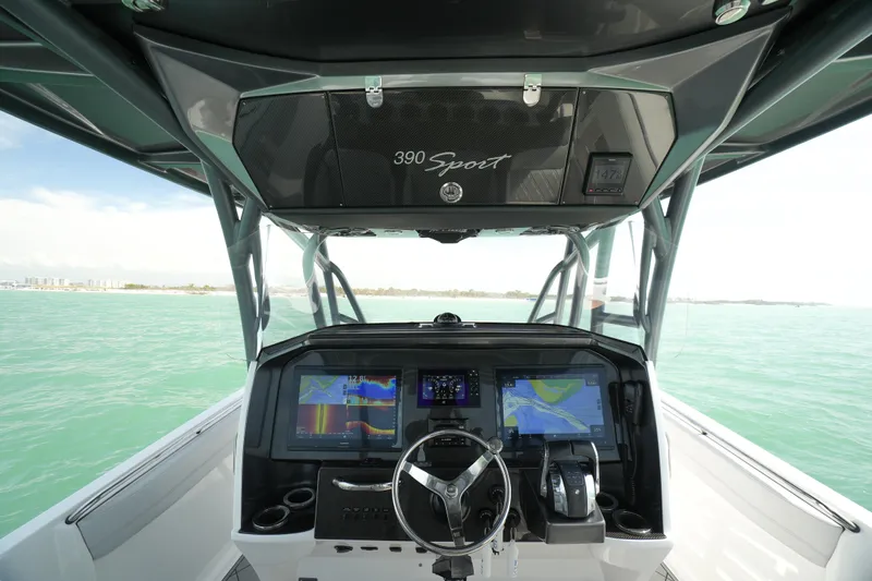 My Mermaid Yacht Photos Pics 2020 Nor-Tech 390 Sport Center Console dashboard with advanced navigation systems on open water.