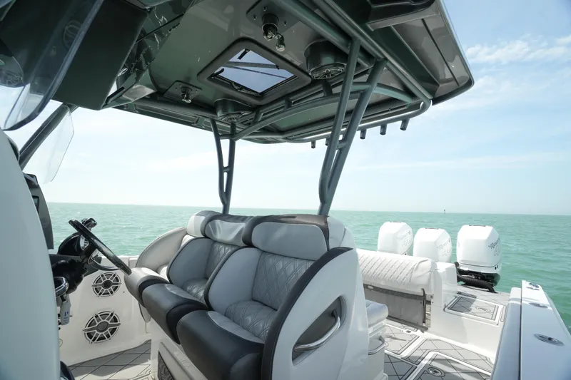 My Mermaid Yacht Photos Pics 2020 Nor-Tech 390 Sport Center Console boat interior with seating and ocean view.