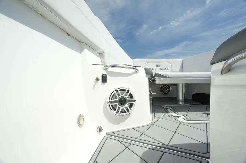 My Mermaid Yacht Photos Pics 2020 Nor-Tech 390 Sport Center Console interior with speaker and seating, under a clear sky.