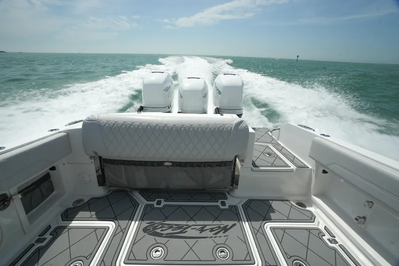 My Mermaid Yacht Photos Pics 2020 Nor-Tech 390 Sport Center Console speeding on open water, showcasing powerful engines.