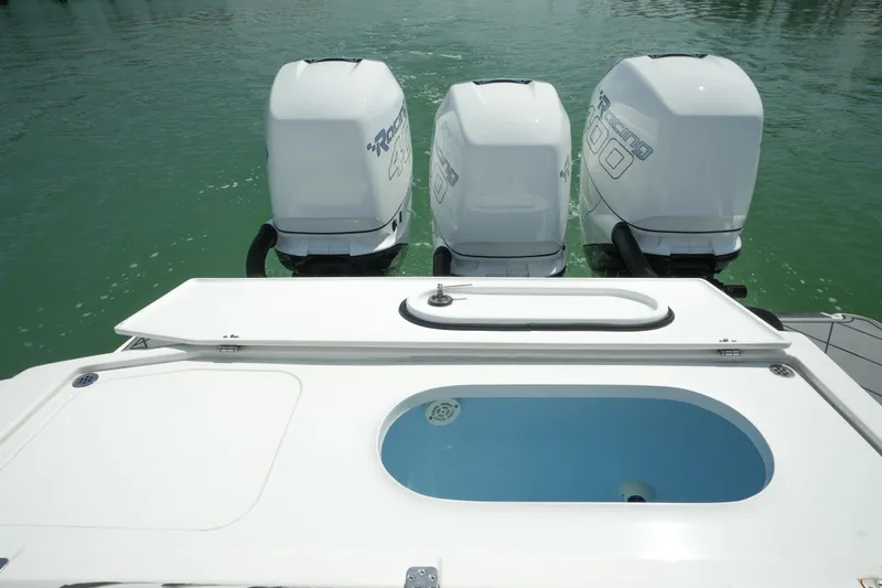 My Mermaid Yacht Photos Pics 2020 Nor-Tech 390 Sport Center Console with triple outboard engines on calm water.