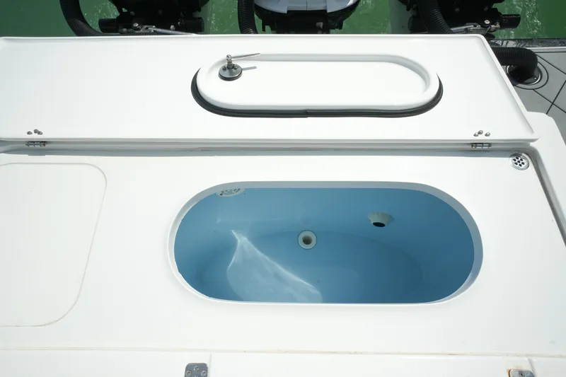 My Mermaid Yacht Photos Pics Livewell on 2020 Nor-Tech 390 Sport Center Console boat, open lid, blue interior.