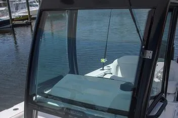  Yacht Photos Pics Manufacturer Provided Image: 2020 Everglades 273 Center Console boat windshield and console at marina.