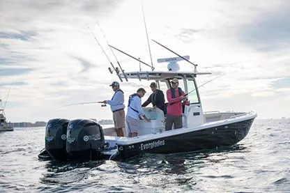  Yacht Photos Pics Manufacturer Provided Image: 2020 Everglades 273 Center Console boat with people fishing on open water.
