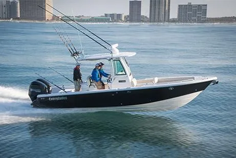  Yacht Photos Pics Manufacturer Provided Image: 2020 Everglades 273 Center Console boat cruising on water with city skyline in background.