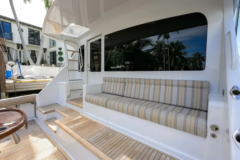 Pryorities Yacht Photos Pics 2008 Viking 60 Convertible yacht with striped seating and wooden deck.