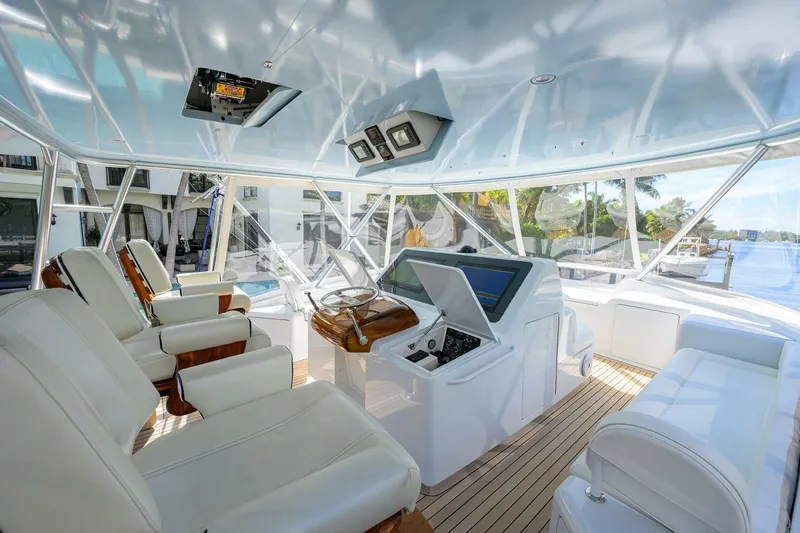 Pryorities Yacht Photos Pics Luxurious interior of 2008 Viking 60 Convertible yacht with modern helm and seating.