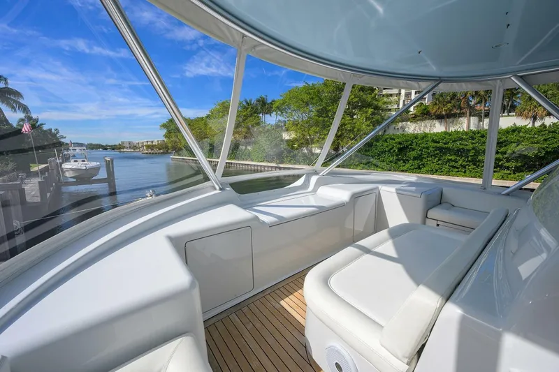 Pryorities Yacht Photos Pics 2008 Viking 60 Convertible yacht interior with white seating and scenic waterfront view.