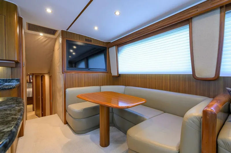 Pryorities Yacht Photos Pics Luxurious interior of 2008 Viking 60 Convertible yacht with cozy seating and TV.