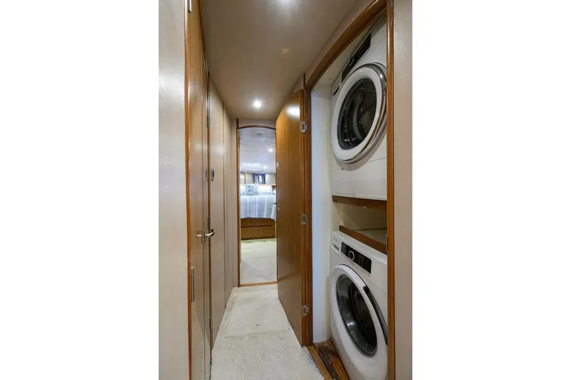 Pryorities Yacht Photos Pics Laundry area in 2008 Viking 60 Convertible yacht with stacked washer and dryer.