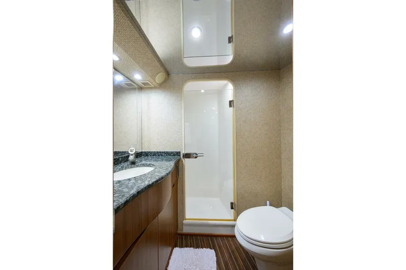 Pryorities Yacht Photos Pics Luxurious bathroom in 2008 Viking 60 Convertible yacht with modern fixtures and elegant design.