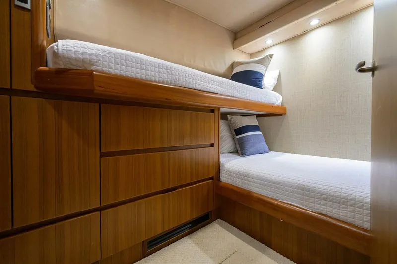 Pryorities Yacht Photos Pics Cozy bunk beds in 2008 Viking 60 Convertible yacht cabin with wooden cabinetry.