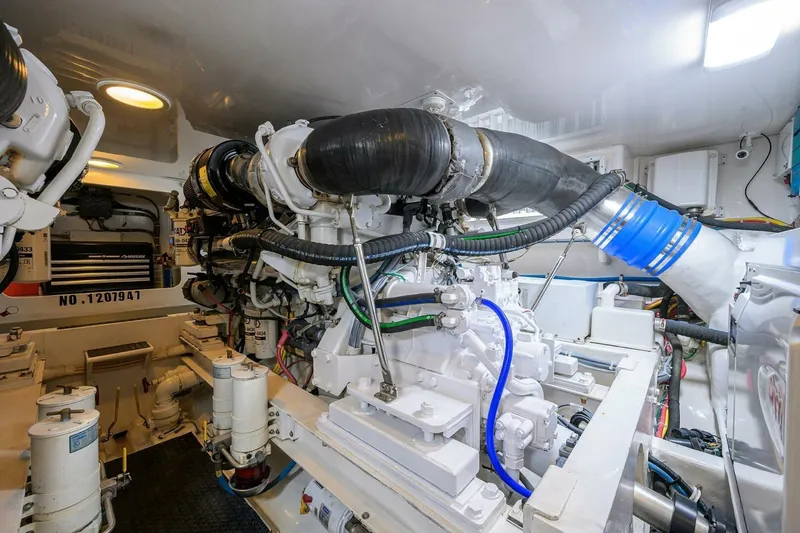 Pryorities Yacht Photos Pics Engine room of 2008 Viking 60 Convertible yacht, showcasing complex machinery and components.
