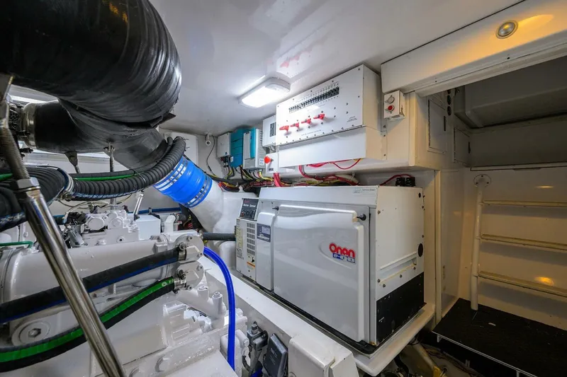 Pryorities Yacht Photos Pics Engine room of 2008 Viking 60 Convertible yacht with Onan generator and control panel.