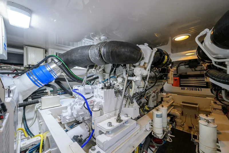 Pryorities Yacht Photos Pics Engine room of 2008 Viking 60 Convertible yacht, showcasing complex machinery and components.