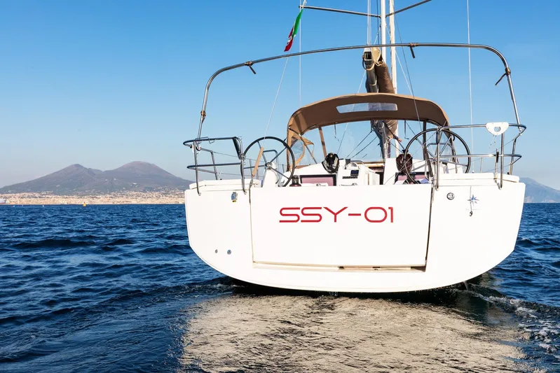 Ssy 01 Yacht Photos Pics Jeanneau Sun Odyssey 440 sailboat on open water, 2021 model, with scenic mountain backdrop.
