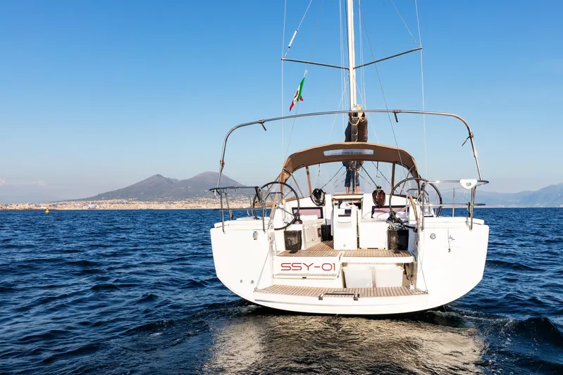 Ssy 01 Yacht Photos Pics Jeanneau Sun Odyssey 440 sailing on open sea, 2021 model, with scenic mountain backdrop.