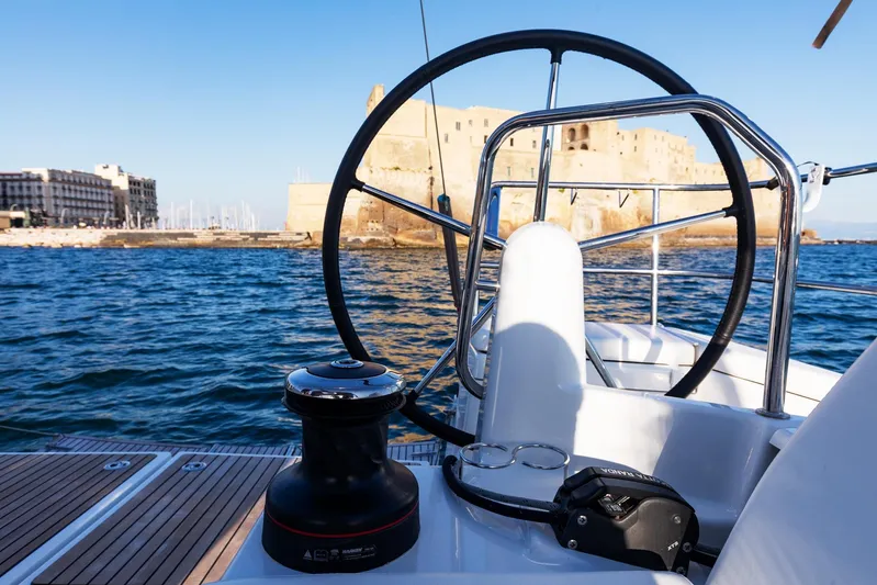 Ssy 01 Yacht Photos Pics Jeanneau Sun Odyssey 440 sailboat helm with coastal view, 2021 model.