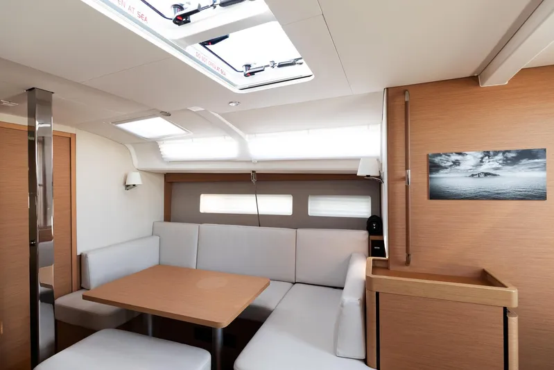 Ssy 01 Yacht Photos Pics Interior of 2021 Jeanneau Sun Odyssey 440 yacht, featuring modern seating and natural light.