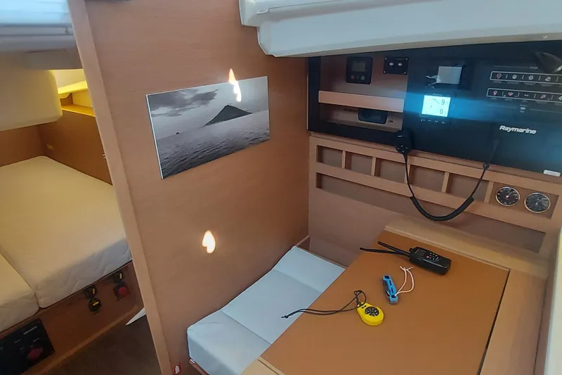 Ssy 01 Yacht Photos Pics Interior of 2021 Jeanneau Sun Odyssey 440 sailboat with navigation equipment and cozy cabin.