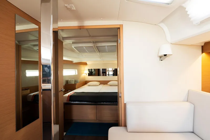 Ssy 01 Yacht Photos Pics Interior of 2021 Jeanneau Sun Odyssey 440 yacht, featuring a cozy bedroom and modern design.