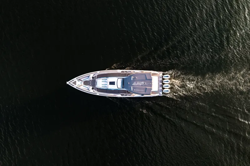  Yacht Photos Pics Aerial view of AMP 443 boat cruising on dark water, 2025 model.