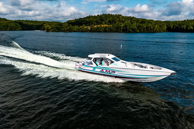  Yacht Photos Pics High-speed AMP 443 boat cruising on a scenic lake, 2025 model.