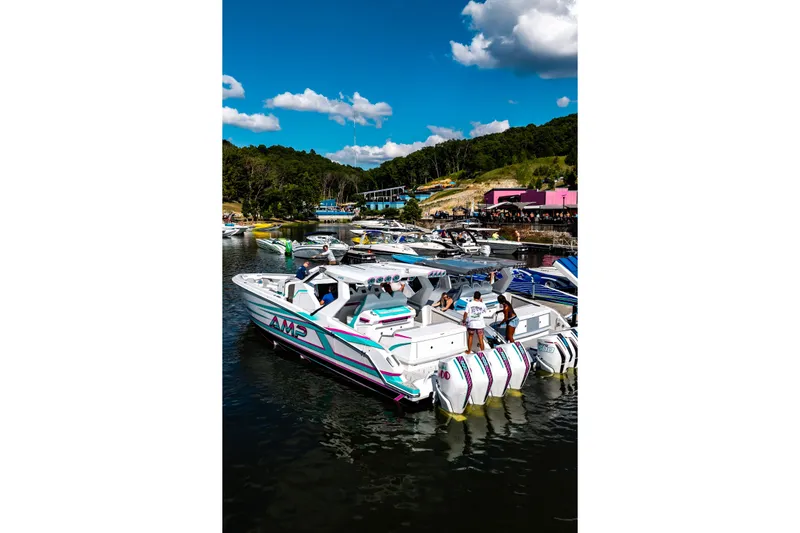  Yacht Photos Pics Futuristic AMP 443 boat docked at a scenic marina, 2025 model.